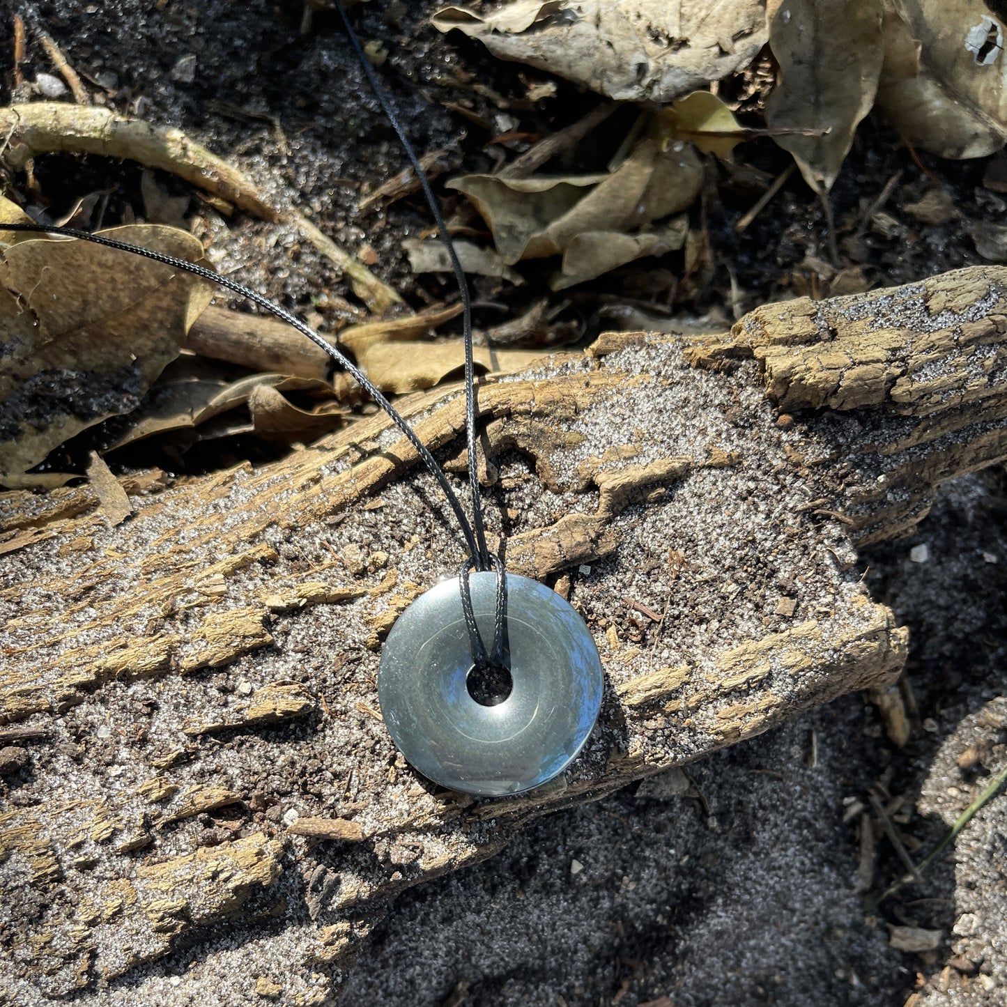 "Break the Spell" Hematite Donut Pendant Cotton Necklace