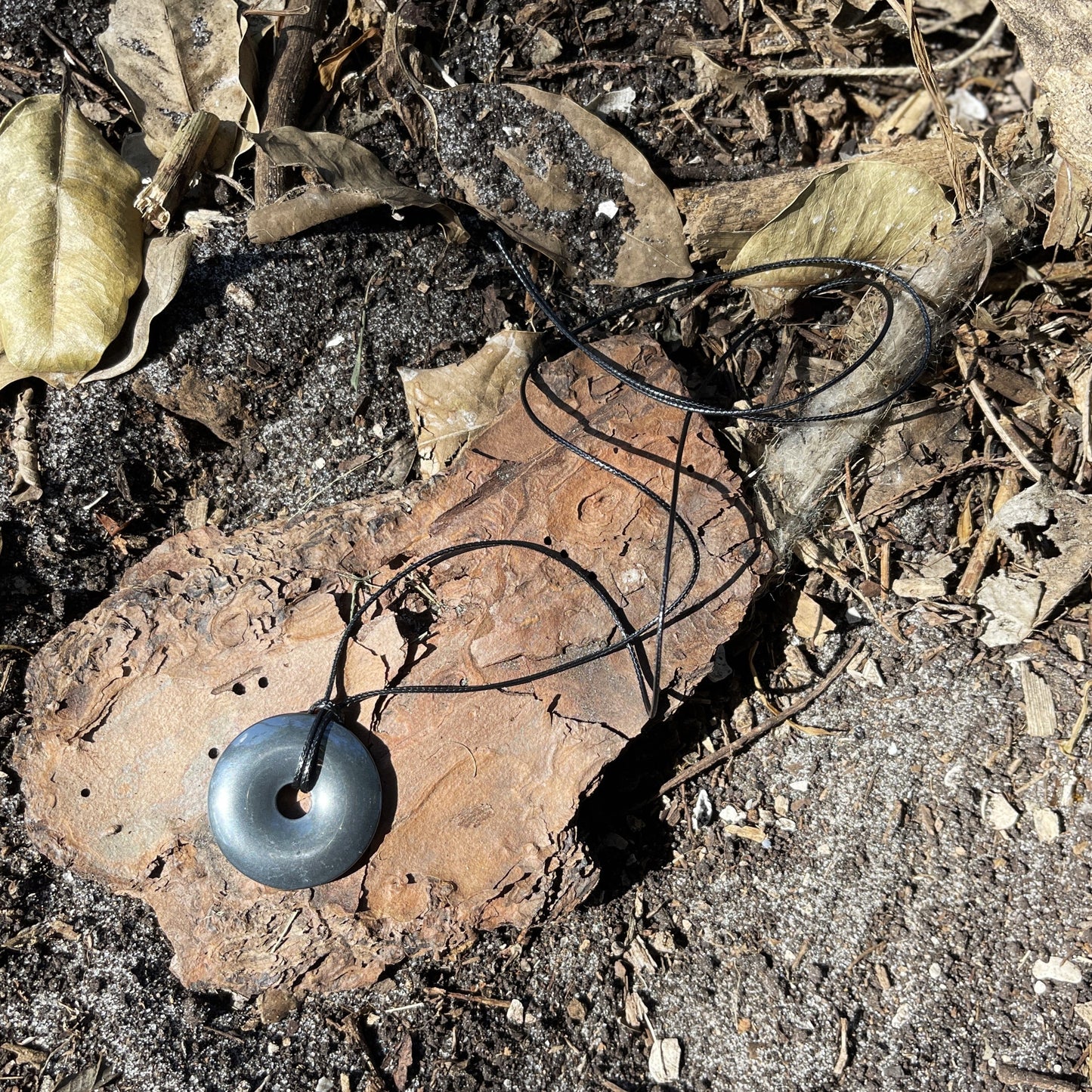 "Break the Spell" Hematite Donut Pendant Cotton Necklace